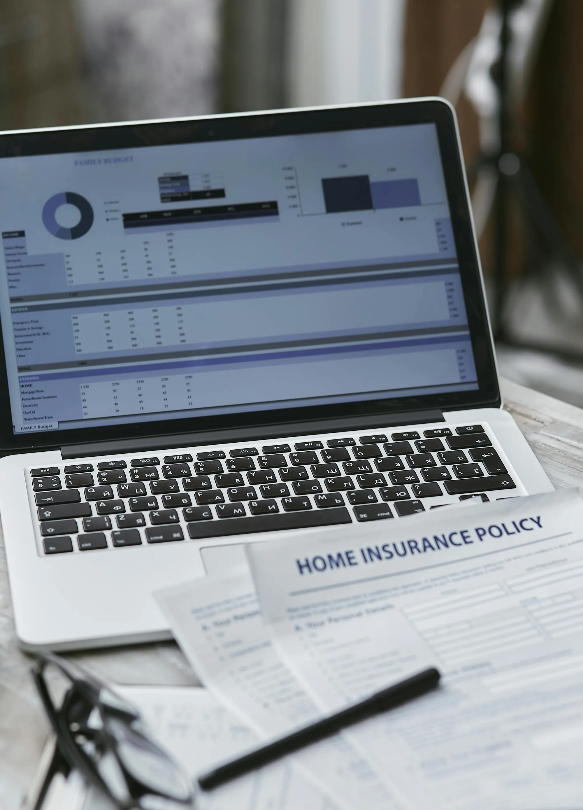 Reviewing a home insurance policy alongside a household budget